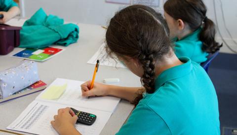 Student using calculator for KS1 maths