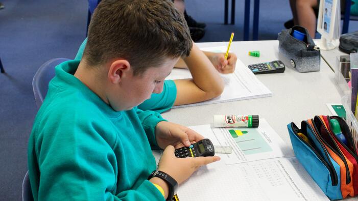 child using a calculator